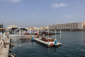 Fototapeta na wymiar Dubai, United Arab Emirates - 28.04.2022 : Canal in Dubai and view of Deira, old city area