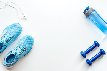 Athletics set with sneakers and dumbbells, top view