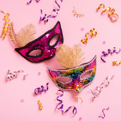Festive face mask for carnival celebration on colored background