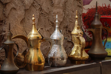 Fototapeta na wymiar Old coffee pots in a shop window in Deira, Dubai's old district
