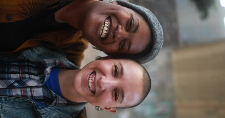 Young mulitracial women smiling on camera - Vertical video - Powered by Adobe