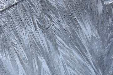 Frosty patterns on the glass of ice crystals.