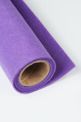 Soft felt textile material lilac colors, colorful texture fabric roll closeup