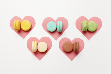 Variety of colorful french sweet dessert macaron with different fillings.