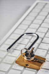 golden color lock with keys on a computer keyboard, the concept of reliable protection of personal...