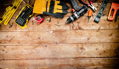 Working tool. Screwdriver with self-tapping screws on the table. 