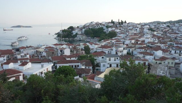 Old Port and town from elevated position at sunset, Skiathos Town, Skiathos, Sporades Islands, Greek Islands