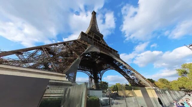 dynamic timelapse video of Eifel tower view from below in Paris with blue sky
