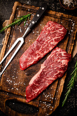 Raw steak on a cutting board. 