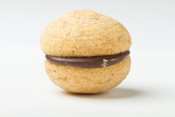 Studio shot close up on baci di dama, northern italian cookie recipe, resting on white background.