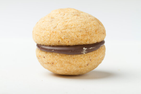 Studio shot close up on baci di dama, northern italian cookie recipe, resting on white background.