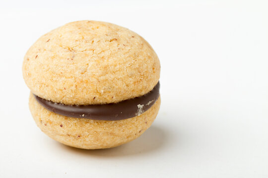 Studio shot close up on baci di dama, northern italian cookie recipe, resting on white background.