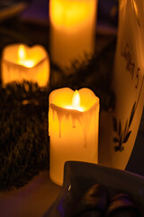 Close up of classic candle with orange flames burning on