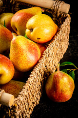 Fresh pears in a basket. 