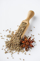 aromatic dry anise seeds on a white background