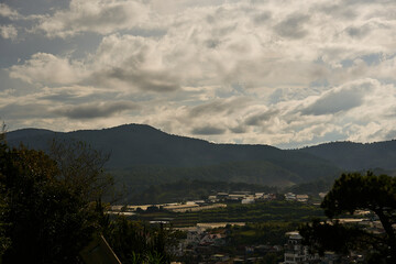 morning scene of hills, clouds and peaceful sunrise sky background in Da Lat highland, Vietnam