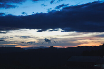 morning scene of hills, clouds and peaceful sunrise sky background in Da Lat highland, Vietnam