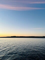 Evening lake view, sky reflection on the lake surface, idyllic lake horizon 