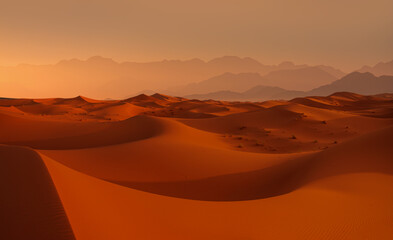 Fototapeta na wymiar Sand dunes in the Sahara Desert, Merzouga, Morocco - Orange dunes in the desert of Morocco - Sahara desert, Morocco