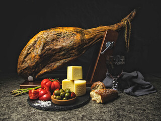 leg jamon whole with olives tomato cheese composition - 564309617