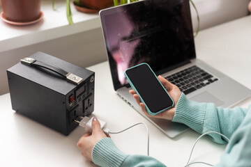 Charging station for phone, tablet, laptop and other gadgets when there is no light during...