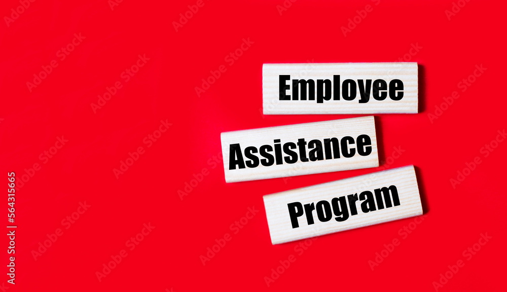 Poster three wooden blocks with the text eap employee assistance program on a bright red background. copy s