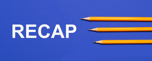 Photo of three orange pencils on a blue background with the text RECAP