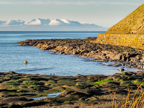 View looking towards the snow capped peaks of the Isle of Arran from Troon shores