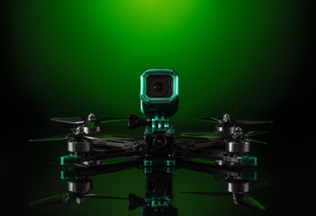 Modern FPV drone. Four-engine aircraft on the radio control. Drone for racing, filming and entertainment.