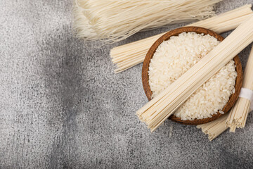 Rice noodles.Rice and noodles with rice flour in a wooden plate on a black background.Close-up....