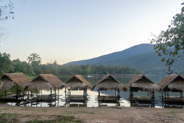 Fototapeta na wymiar Straw floating huts on the water at Huay Tueng Thao Reservoir in Chiang Mai, Thailand.