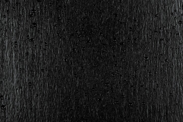 Water drops on dark stone