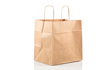 Paper shopping bag on white