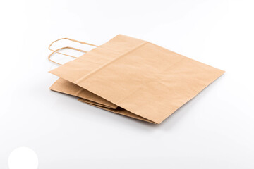 Paper shopping bag on white