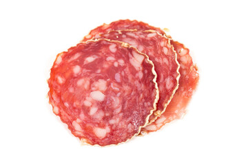 Slices of salami sausage on a white background