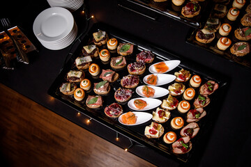 Catering plate. Assortment of snacks on the buffet table.