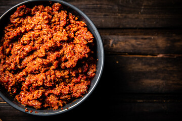 Bolognese sauce in a bowl on the table. 
