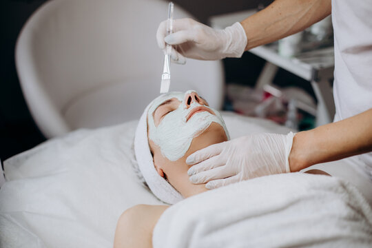 woman beautician procedure facial skin cleansing care