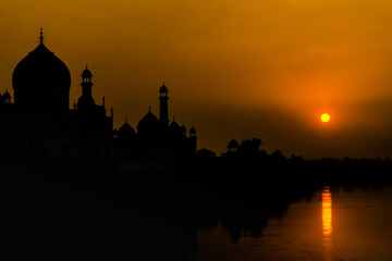 Fototapeta na wymiar Agra, India - October 19th, 2022 : Sunset at Taj Mahal