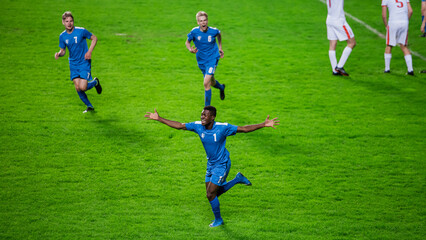 Championship Match: Blue Soccer Football Team Attack, Black Player Run Happy after Scoring Goal,...