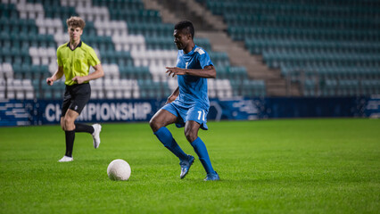 Major League Soccer Football Championship. Portrait of Blue Team Player Dribbling, Attacking Opponents Goals, Determined to Score. Sport Channel, Broadcast Television Concept.
