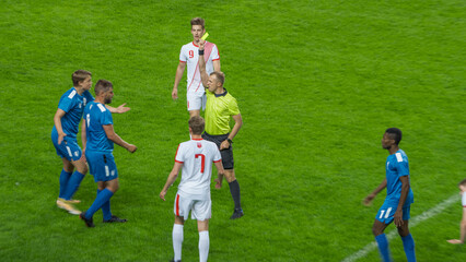 Soccer Football Championship Match: Referee Sees Foul, Gives Signal and Yellow Card, Players Circle...