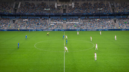 Soccer Football Championship Stadium with Crowd of Fans: Blue Team Starts The Game With Kick Off, Beginning of International Tournament Finals. Sport Channel Broadcast Television Concept. High Angle. - obrazy, fototapety, plakaty