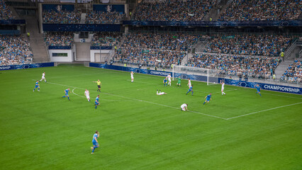 Soccer Football Championship Stadium with Crowd of Fans: Blue Team Attacks, Scores Goal, Players Celebrate Victory, Winners of Tournament. Sport Channel Broadcast Television. High Angle Wide Shot.