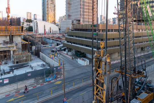 TEL AVIV, ISRAEL - MAY 01 2022: Somail complex in Tel Aviv in the evening with the moon rising. Construction work on the new Tel Aviv Municipality building. Ibn Gvirol Urban Renewals.Migdal HaMeah