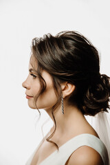 close-up portrait of the bride in profile on a white background