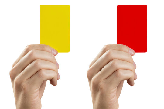 Football (soccer) referee hand holding yellow and red cards, cut out