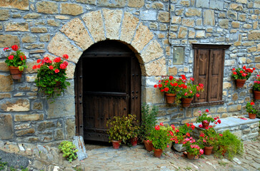 Fototapeta na wymiar House with flowers in Roncal. Roncal Valley. Navarre.