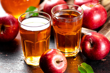 A glass of apple juice on the table. 