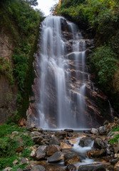 Himachal, India - April 7th, 2022 : waterfall in mountains of himalayas